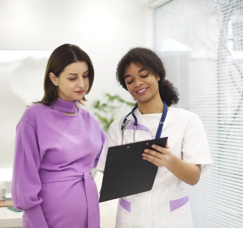 A doctor in consultation with an expectant patient