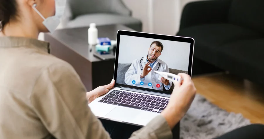 A patient consulting a doctor by video call on a tablet